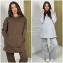 Koop afgeprijsde oversized jogging set met capuchon. Ontdek bescheiden kleding voor meisjes in Rotterdam.